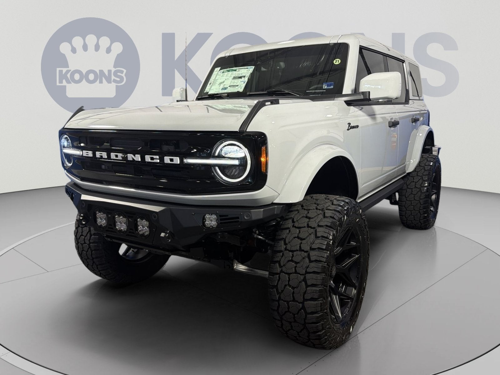 2026 Ford Bronco Outer Banks Lifted in Avalanche — front three-quarter view