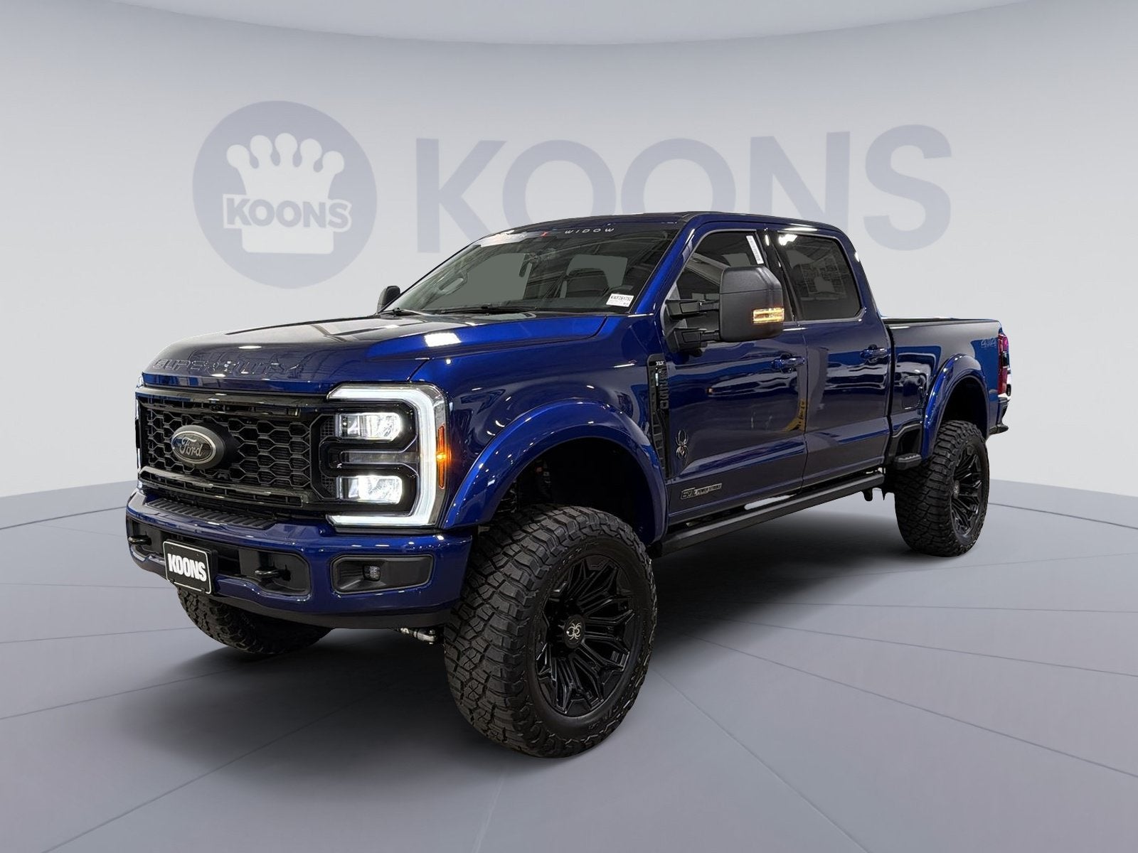 2026 Ford F-250SD XLT Black Widow in Blue Metallic — front three-quarter view