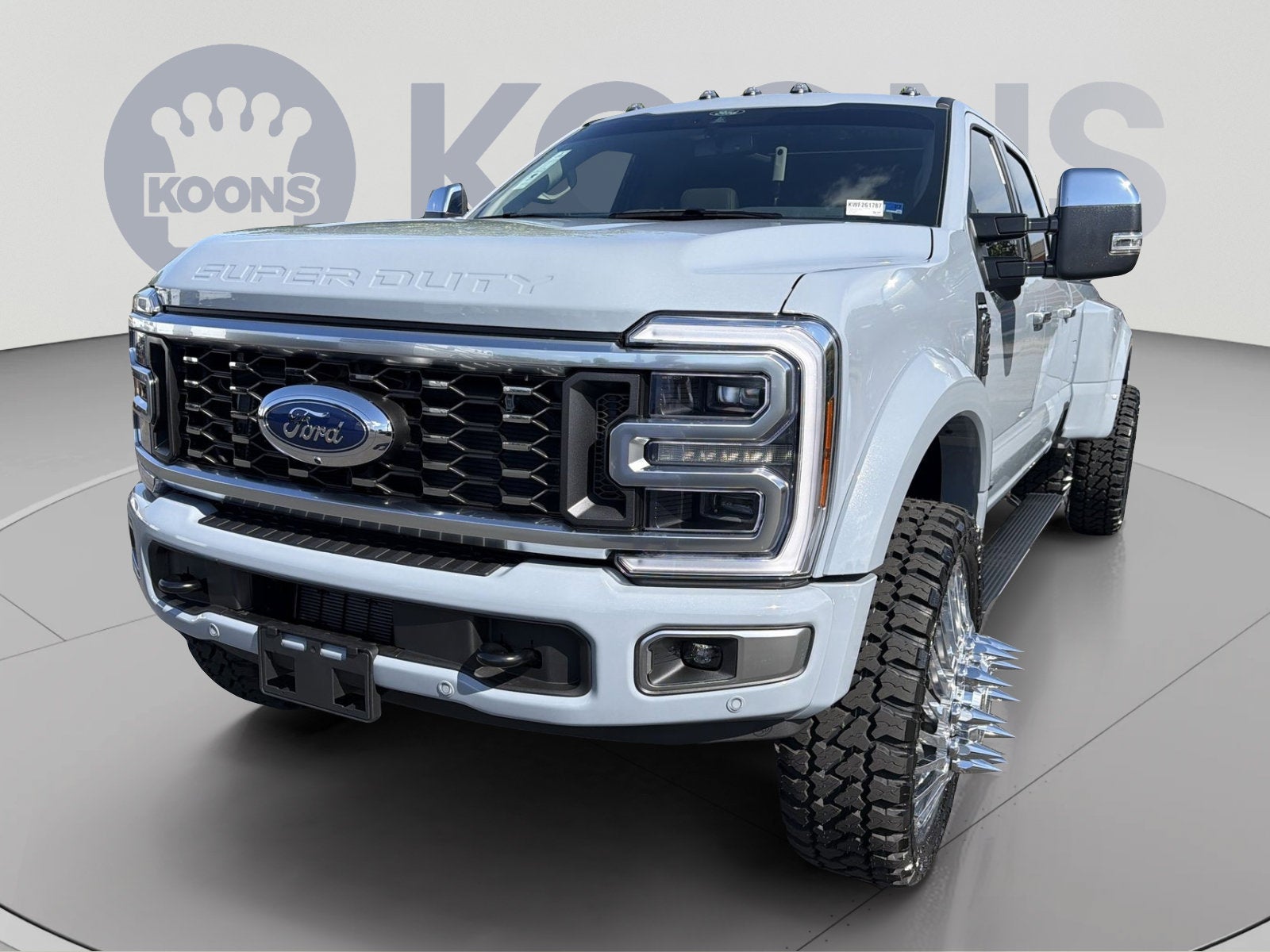 2026 Ford F-450SD Platinum Plus Lifted in Gray Metallic — front three-quarter view