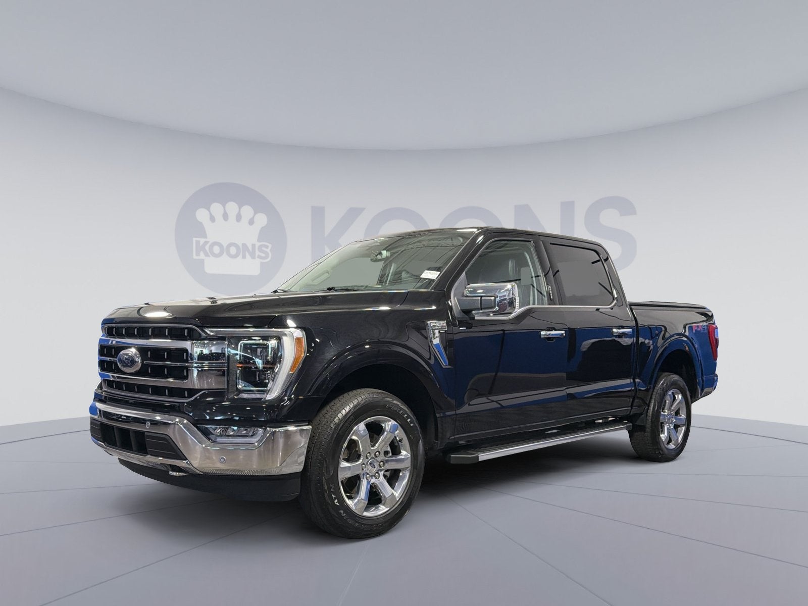 2023 Ford F-150 Lariat in Black Metallic — front three-quarter view