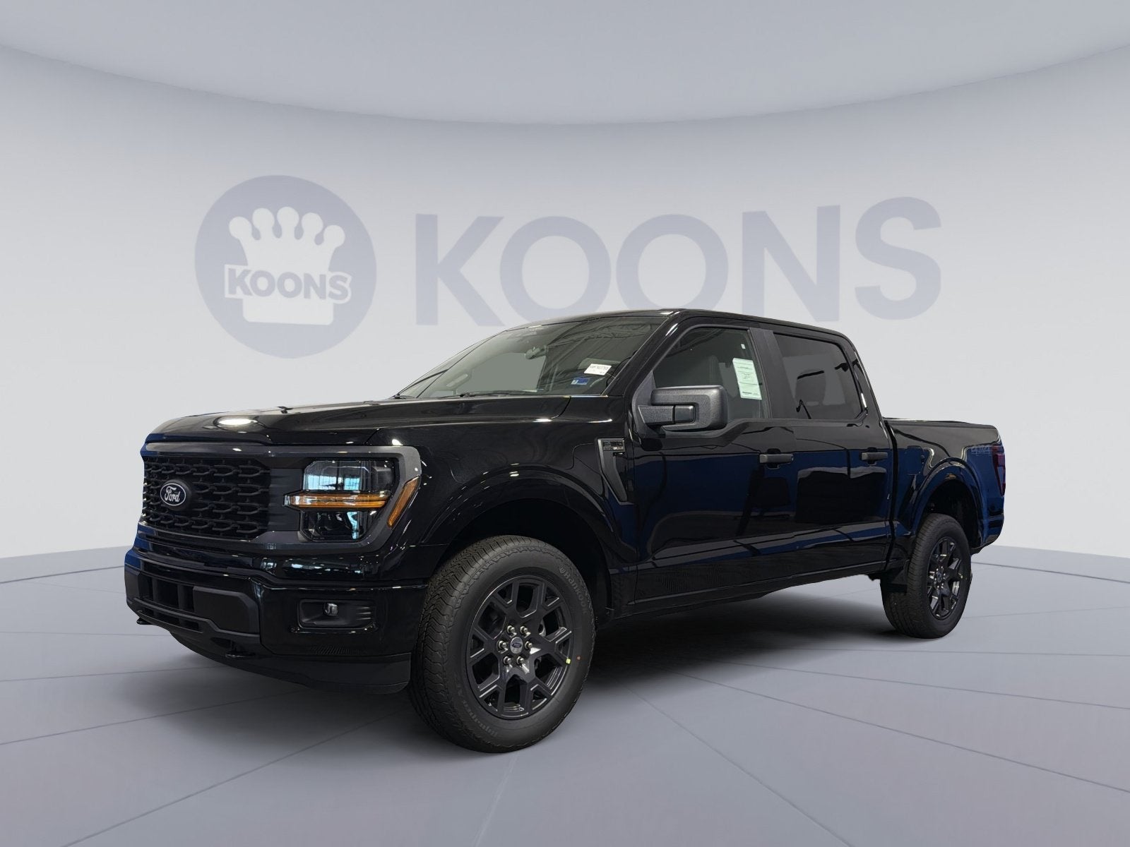 2026 Ford F-150 STX in Black Metallic — front three-quarter view