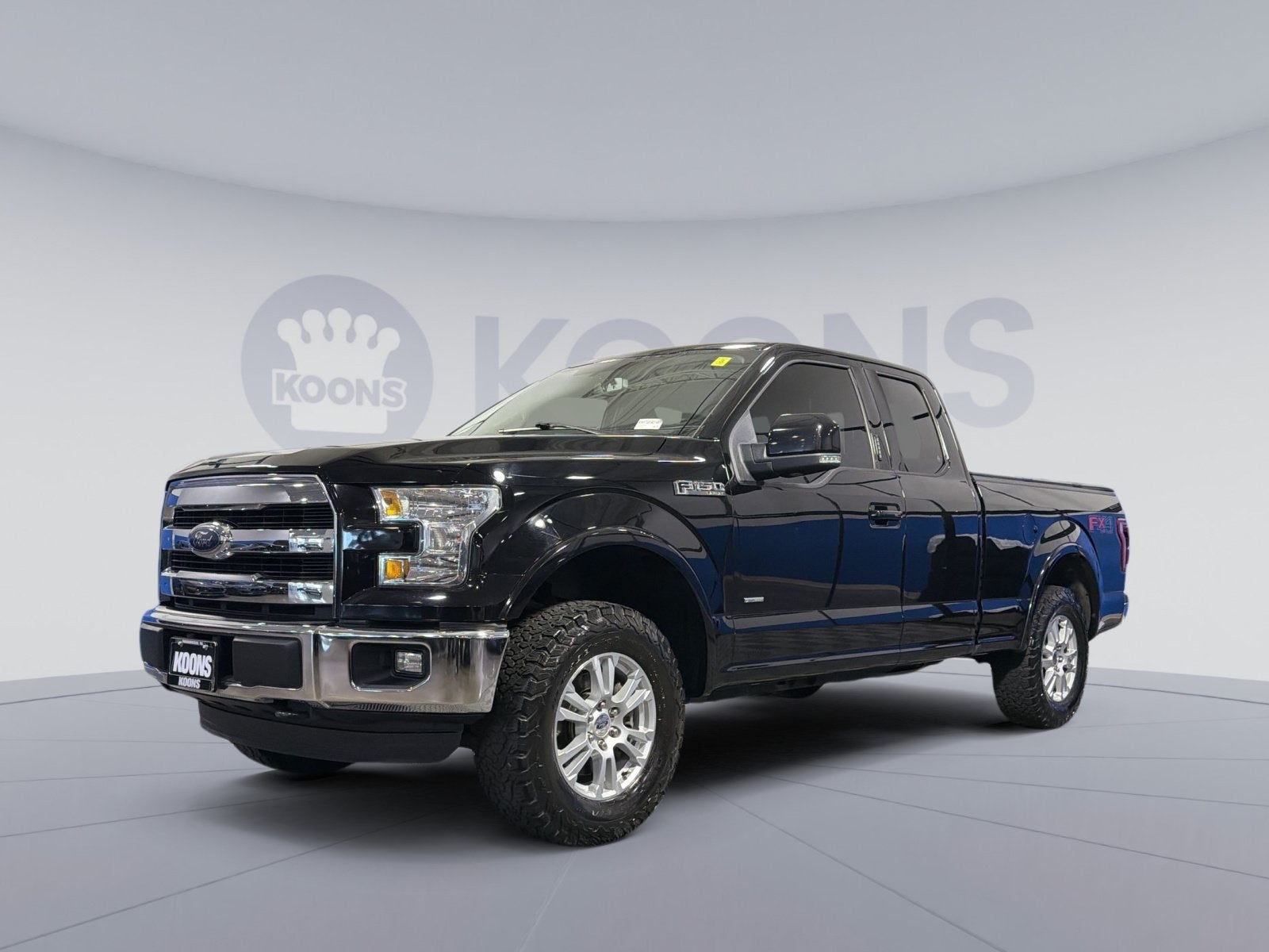 2016 Ford F-150 Lariat in Shadow Black — front three-quarter view