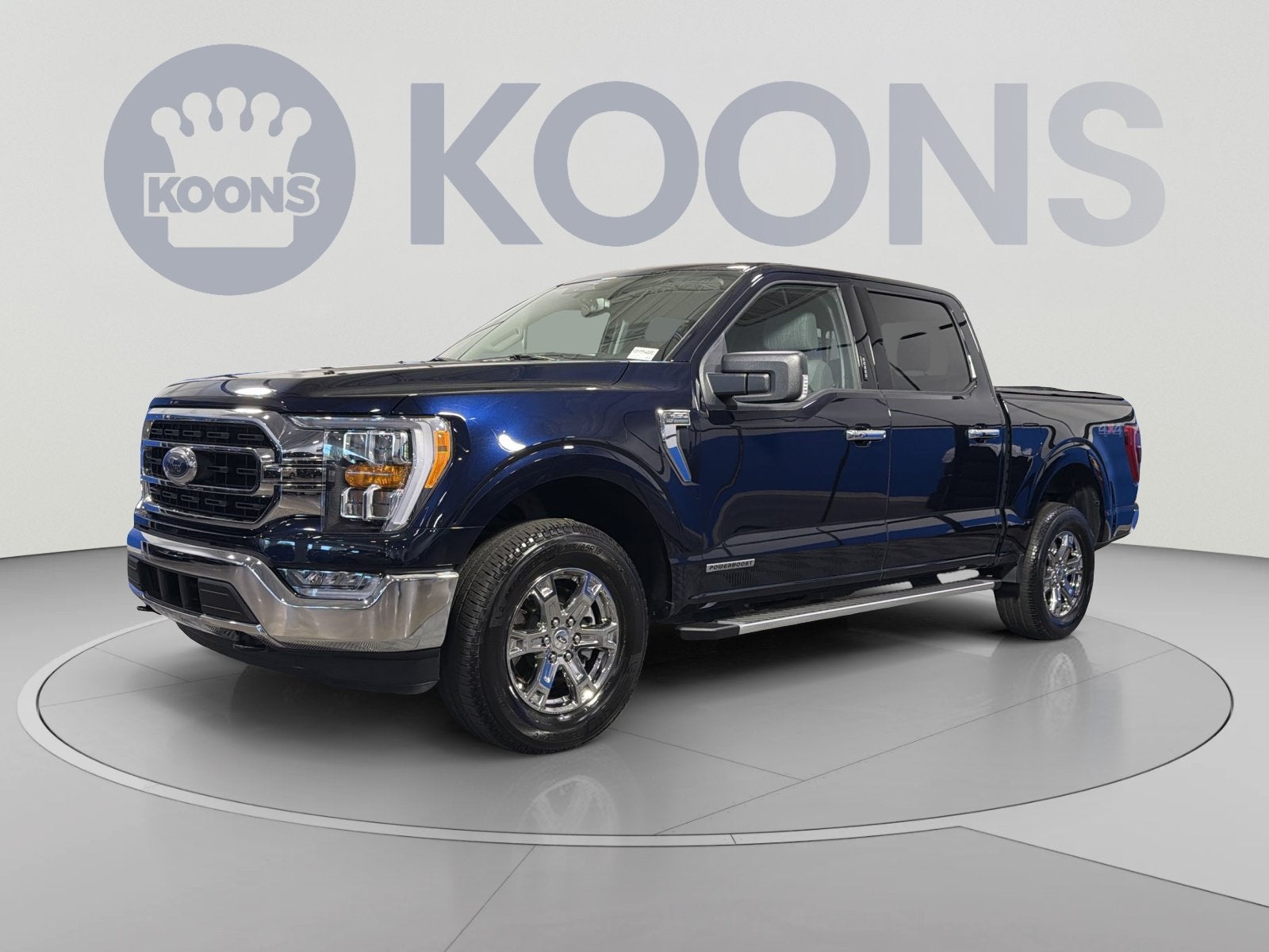 2023 Ford F-150 XLT in Blue Metallic — front three-quarter view