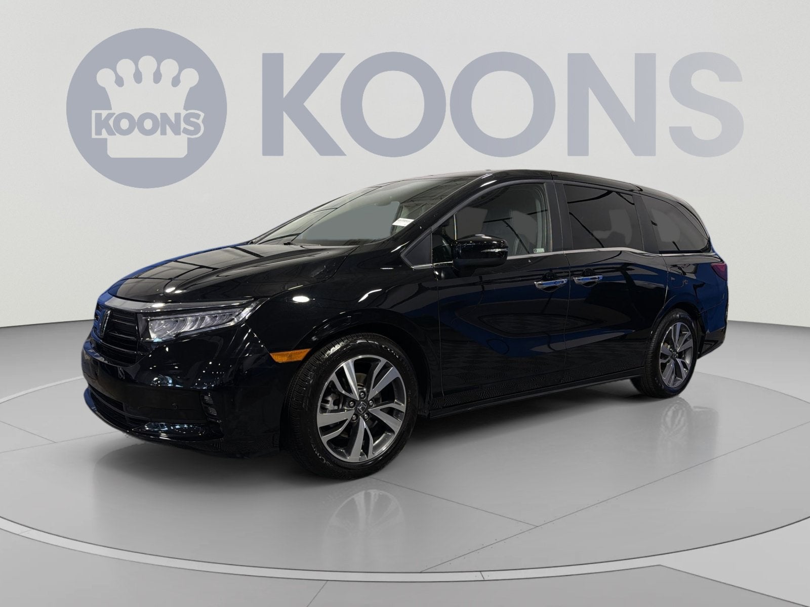 2023 Honda Odyssey Touring in Crystal Black Pearl — front three-quarter view