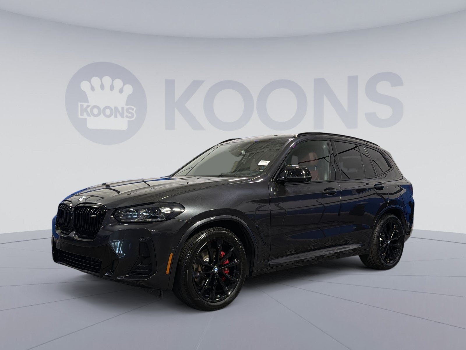 2024 BMW X3 M40i in Dark Graphite Metallic — front three-quarter view